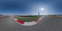 a view of a racing track from a 360 - angle looking straight up at the camera