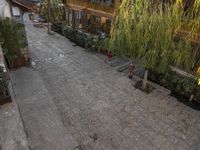 the view of an empty yard in a residential area from above the room is an open air space