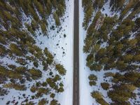 Aerial View of a Snowy Road in Rural Germany