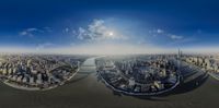 an aerial view of the city that is near the water and on a sunny day