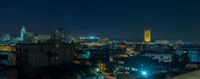 there is a very high rise view of a city from a building in the night