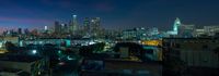 there is a very high rise view of a city from a building in the night