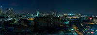 there is a very high rise view of a city from a building in the night