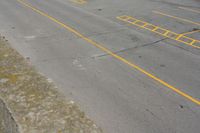 parking meters and parking spaces on the side of a road with parking spaces painted yellow