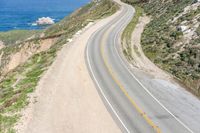 Aerial view of a winding road along a coastal line