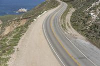 Aerial view of a winding road along a coastal line