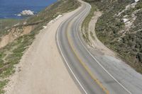 Aerial view of a winding road along a coastal line