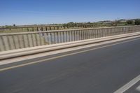 African Landscape: Clear Sky and Coastal Bridge