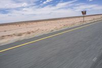 Africa: Rolling Plains under Clear Sky on an Asphalt Road