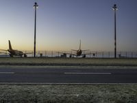 Airplane on Asphalt Runway at Dawn