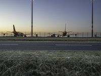 Airplane on Asphalt Runway at Dawn