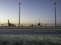 Airplane on Asphalt Runway at Dawn