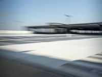 a airplane is sitting on a runway at an airport in motion by itself to take off