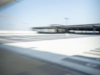 a airplane is sitting on a runway at an airport in motion by itself to take off