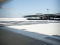 a airplane is sitting on a runway at an airport in motion by itself to take off