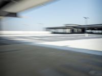 a airplane is sitting on a runway at an airport in motion by itself to take off