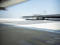 a airplane is sitting on a runway at an airport in motion by itself to take off