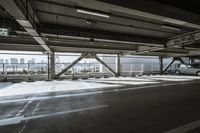 a plane is parked in an airplane hanger at an airport, with another plane nearby