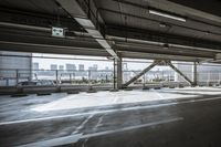 a plane is parked in an airplane hanger at an airport, with another plane nearby