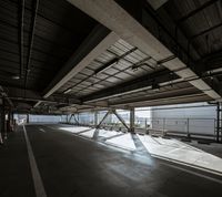 a plane is parked in an airplane hanger at an airport, with another plane nearby