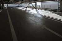 a plane is parked in an airplane hanger at an airport, with another plane nearby