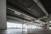 a plane is parked in an airplane hanger at an airport, with another plane nearby