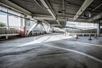 a plane is parked in an airplane hanger at an airport, with another plane nearby