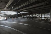 a plane is parked in an airplane hanger at an airport, with another plane nearby