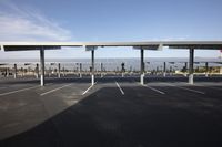 parking lot with several rows of solar panels and poles for parking on the roof in an airport