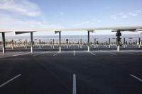 parking lot with several rows of solar panels and poles for parking on the roof in an airport