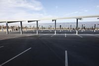 parking lot with several rows of solar panels and poles for parking on the roof in an airport