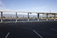 parking lot with several rows of solar panels and poles for parking on the roof in an airport