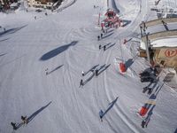 a ski slope and a small snow park with people skiing on it and some snow