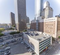 the view from the top of this building is amazing looking down at a parking lot