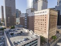 the view from the top of this building is amazing looking down at a parking lot