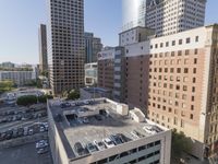 the view from the top of this building is amazing looking down at a parking lot