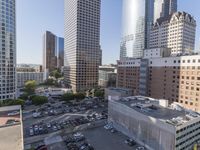 the view from the top of this building is amazing looking down at a parking lot