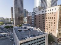 the view from the top of this building is amazing looking down at a parking lot