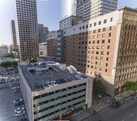 the view from the top of this building is amazing looking down at a parking lot