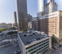 the view from the top of this building is amazing looking down at a parking lot