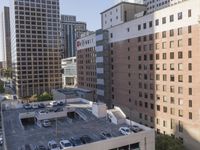 the view from the top of this building is amazing looking down at a parking lot