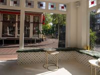 the dining room has windows to take in a good view outside on this patio in the sun