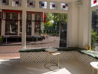 the dining room has windows to take in a good view outside on this patio in the sun