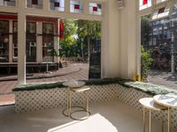 the dining room has windows to take in a good view outside on this patio in the sun