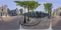 two views of a city street and canal in europe, taken with three different panoramic images