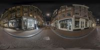 a three lens fisheye photograph of a shopping area at night or day showing a few stores