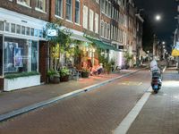 Amsterdam Night: Street Lights and Storefronts