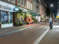 Amsterdam Night: Street Lights and Storefronts