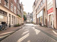 Amsterdam Residential Area: Bicycle Wheel against a Historic Backdrop