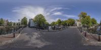 an 360 view of the streets with bikes parked along side the street and trees lining the sides